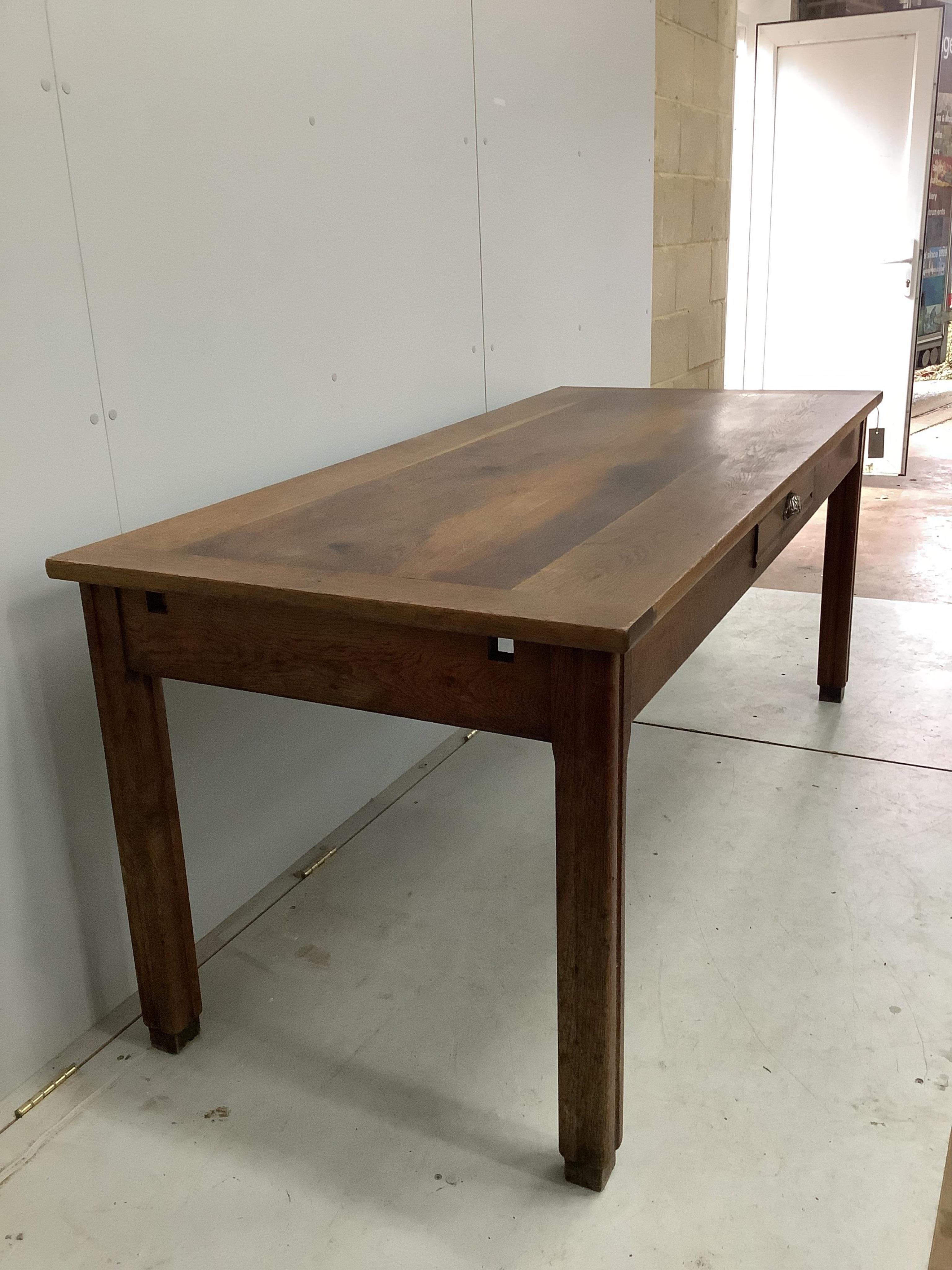 A French rectangular oak farmhouse kitchen table with detachable extension leaves and a single drawer, width 179cm, 277cm extended, depth 79cm, height 77cm. Condition - fair to good